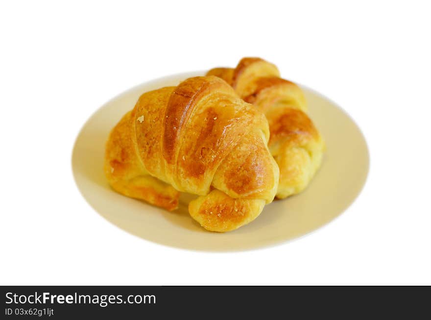 Two fresh croissant ,casting soft whadow on white. Two fresh croissant ,casting soft whadow on white.