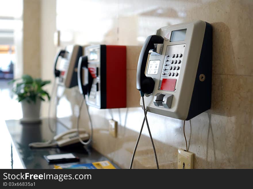 Three public telephone on wall