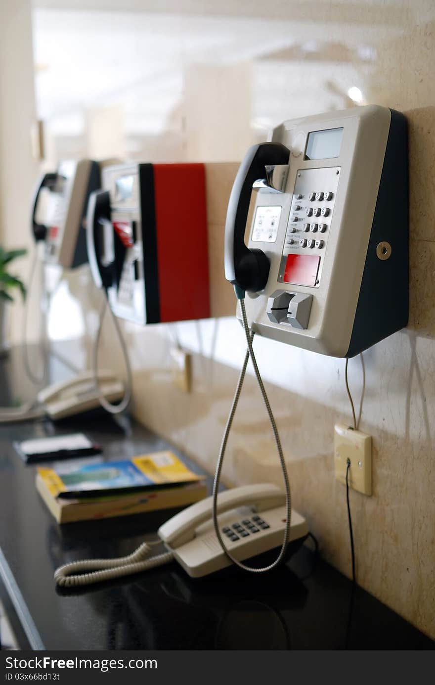 Three public telephone on wall