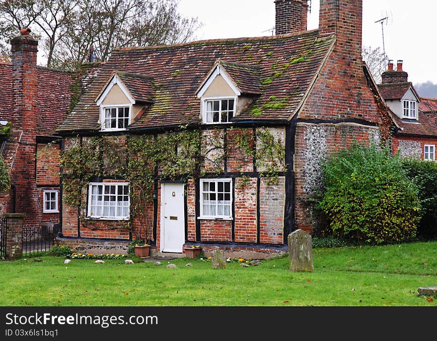 Traditional Timber Framed English Village Cottage with Churchyard in front