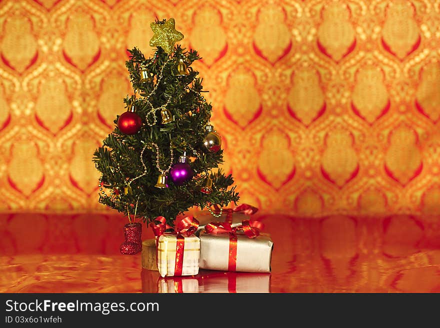 A christmas tree with a star and presents under tree. A christmas tree with a star and presents under tree