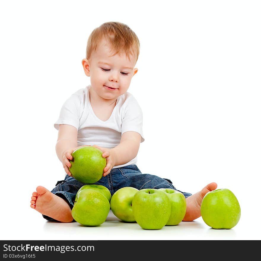 Adorable child with green apples on white