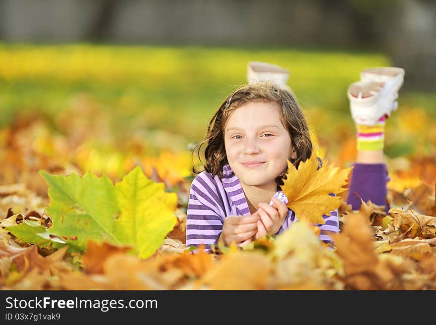 Beautiful girl at autumn