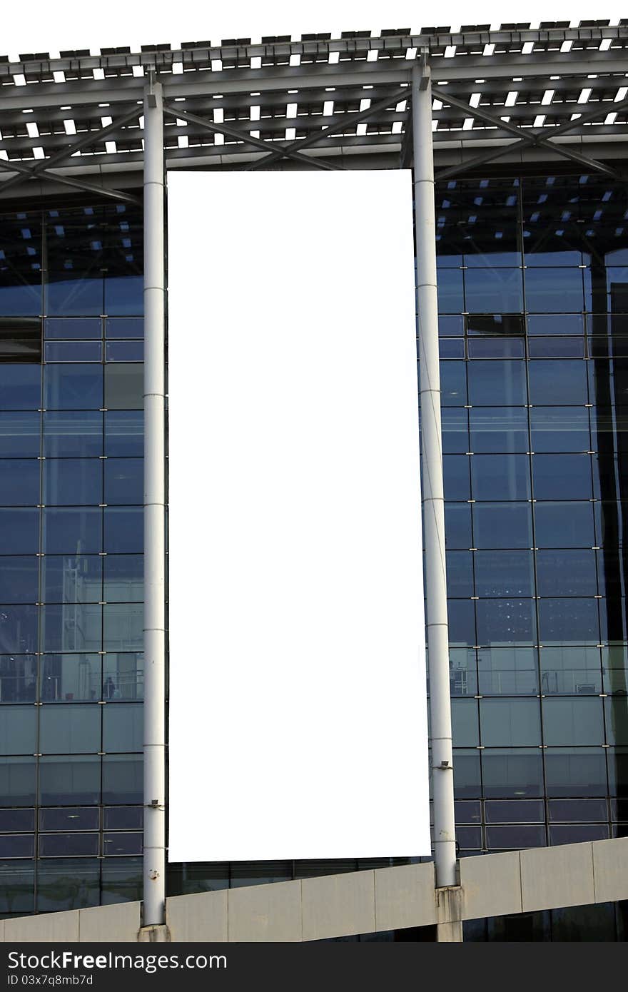 Hanging blank billboard on glass curtain wall of the exhibition hall.