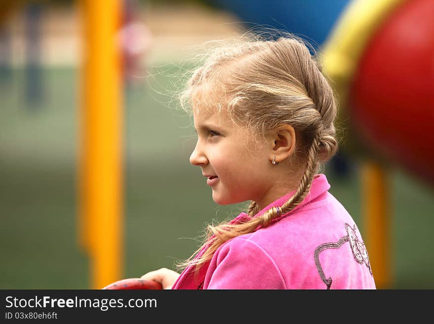 Portrait of blond girl smiling outside autumn day. Portrait of blond girl smiling outside autumn day