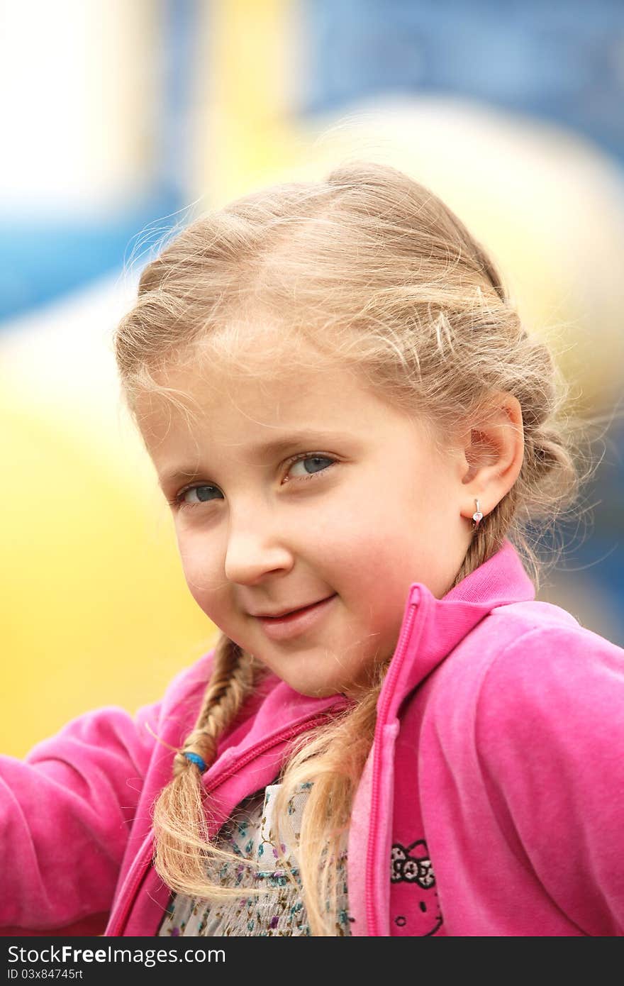 Portrait of blond girl smiling outside autumn day. Portrait of blond girl smiling outside autumn day