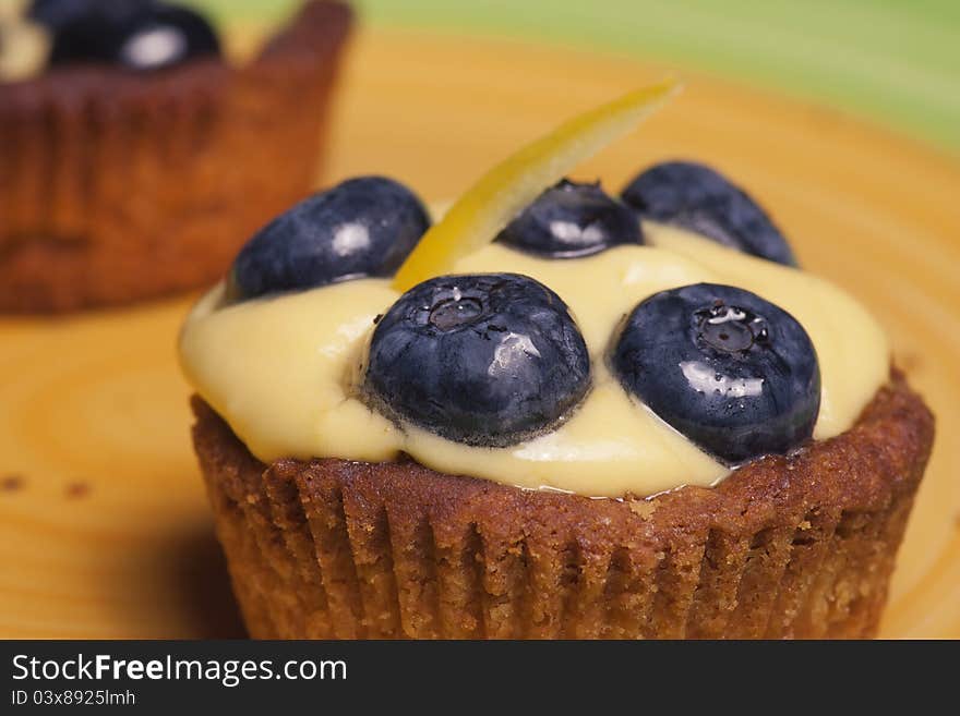 Close-up of cake with fresh bilberries, selective focus. Close-up of cake with fresh bilberries, selective focus.