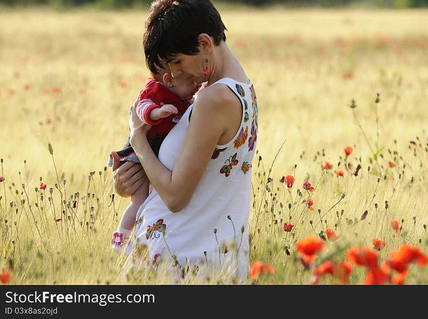 Mother And Daughter In A Poppy Field