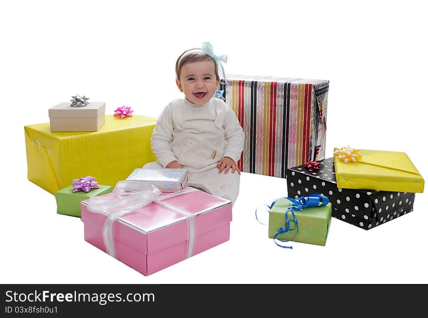 Baby girl with gifts. Isolated on white background