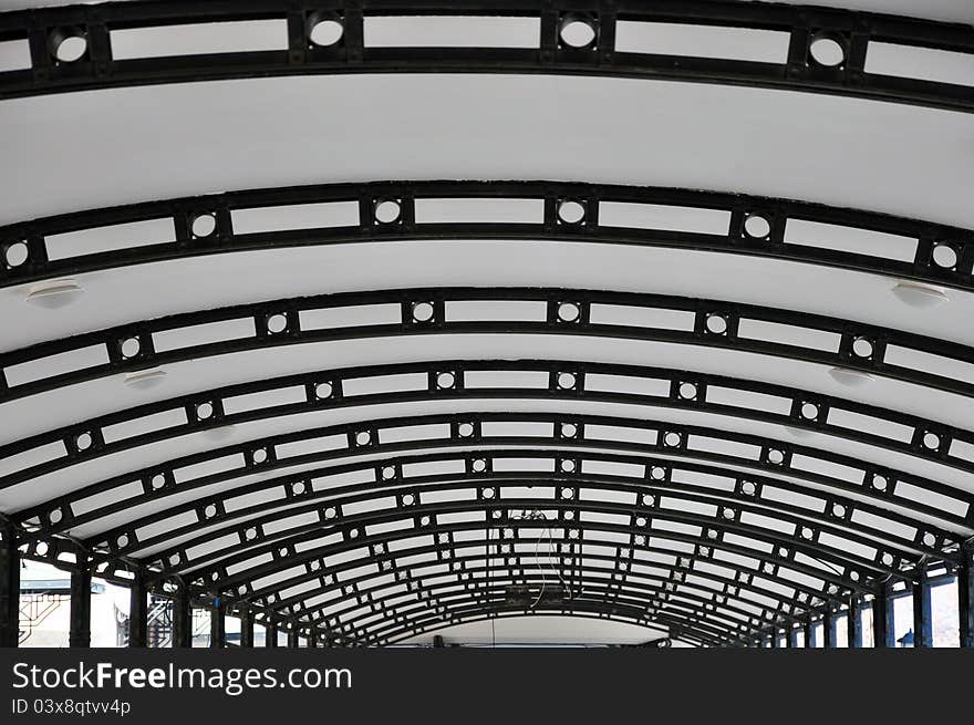 Background with curved roof with metallic structure