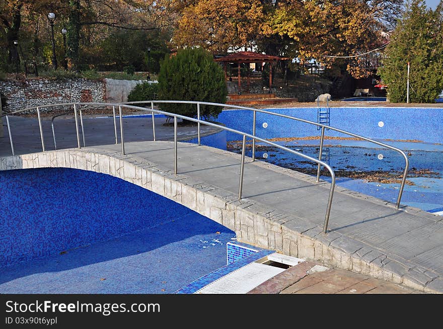 Empty blue pool and bridge. Empty blue pool and bridge