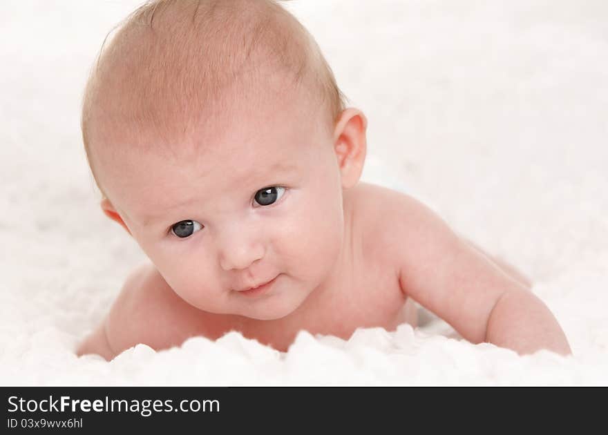 Baby on white bed