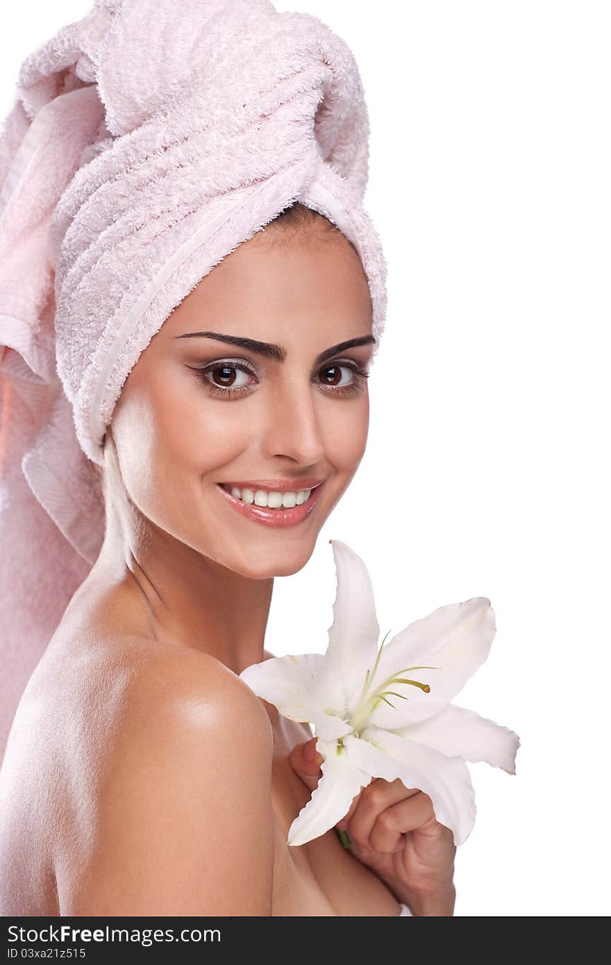 Brunette spa woman in towel on head