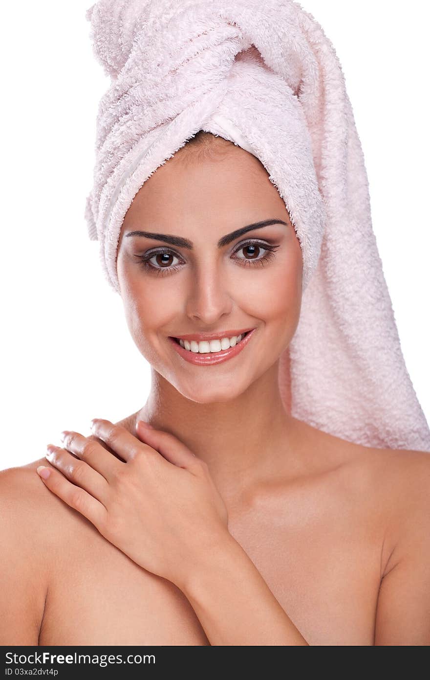 Brunette spa woman in towel on head