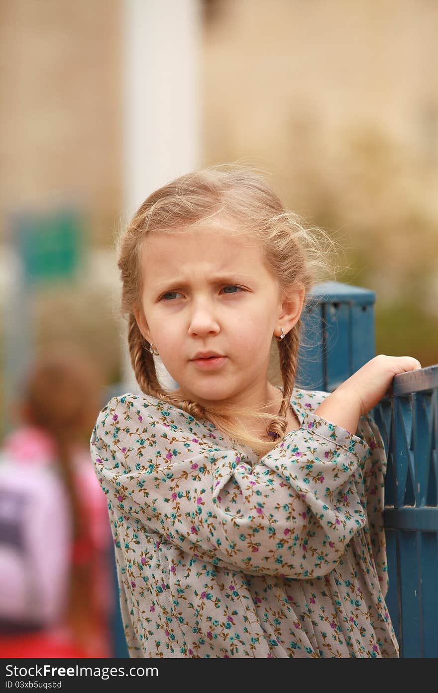 Portrait of blond girl smiling outside autumn day. Portrait of blond girl smiling outside autumn day