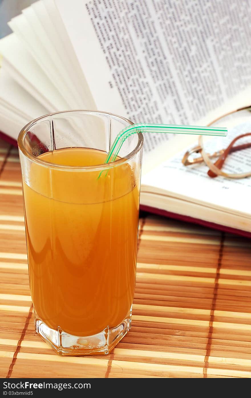 Multifruit Juice With Book And Glasses