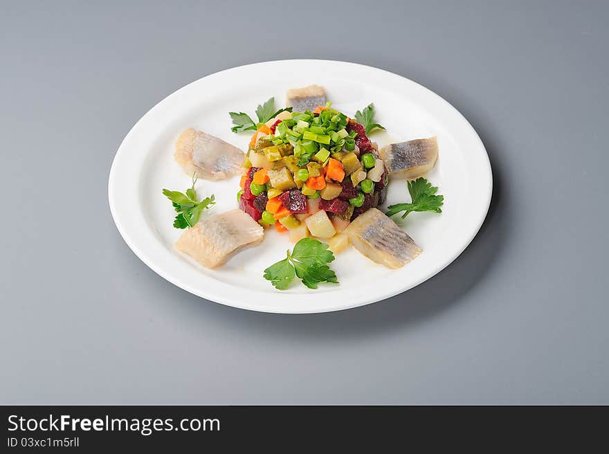 Russian salad with beetroot and herring