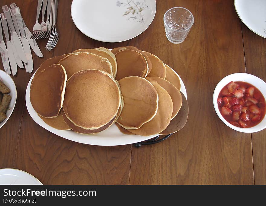 Perfect morning breakfast meal of pancakes with strawberries. Perfect morning breakfast meal of pancakes with strawberries