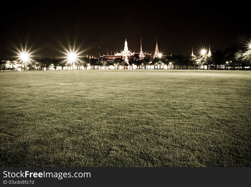 Widely public park with green grass in reduce color mode.