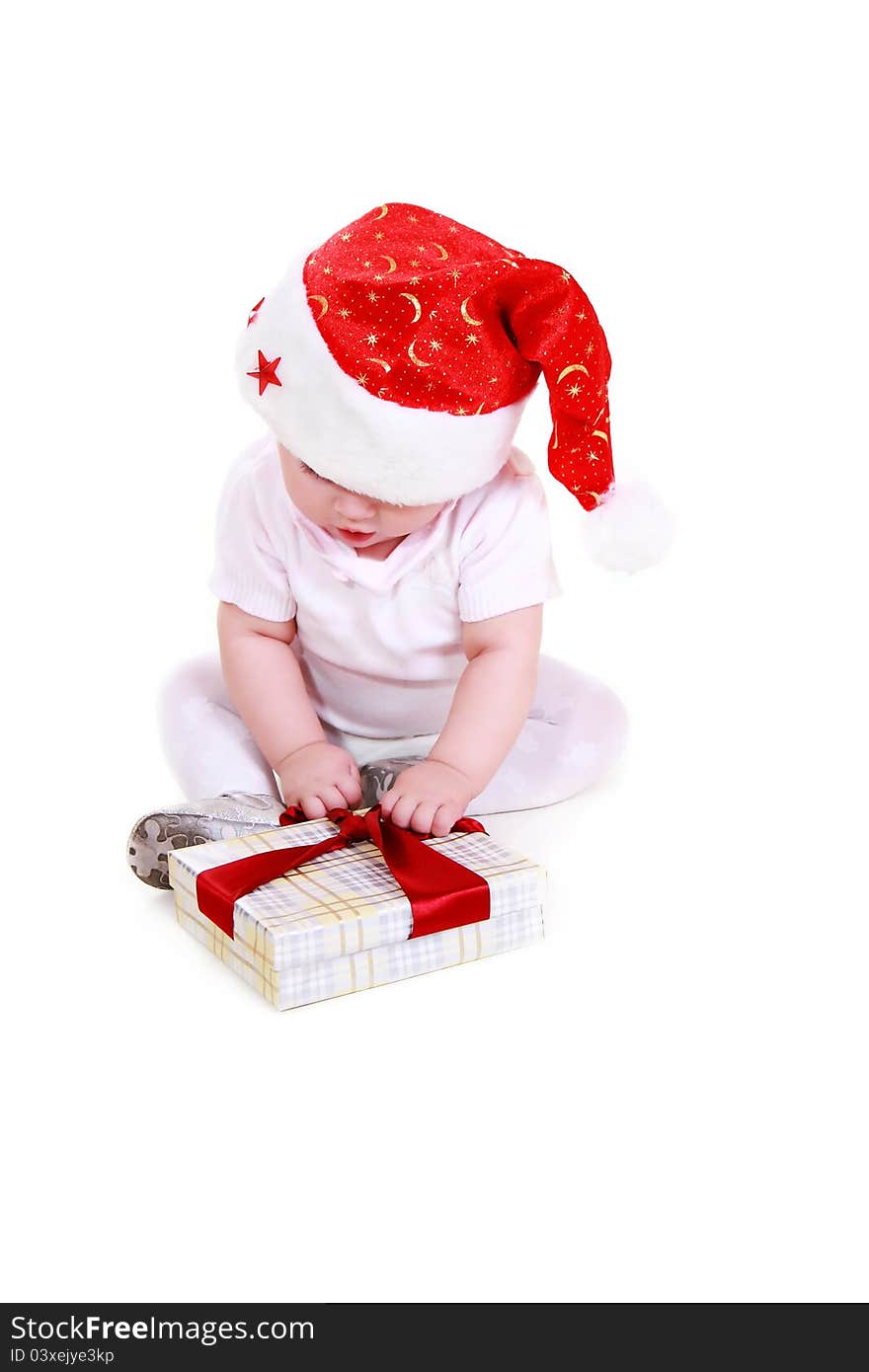 Small Santa Claus with gift on a white background