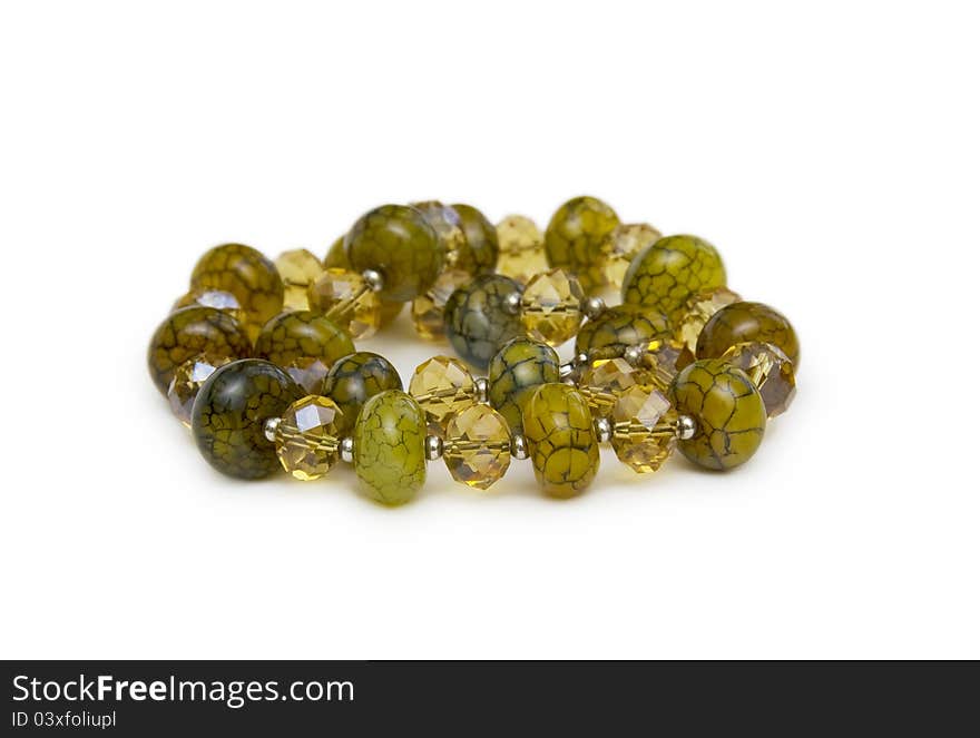 Necklace made of green  beads isolated on white