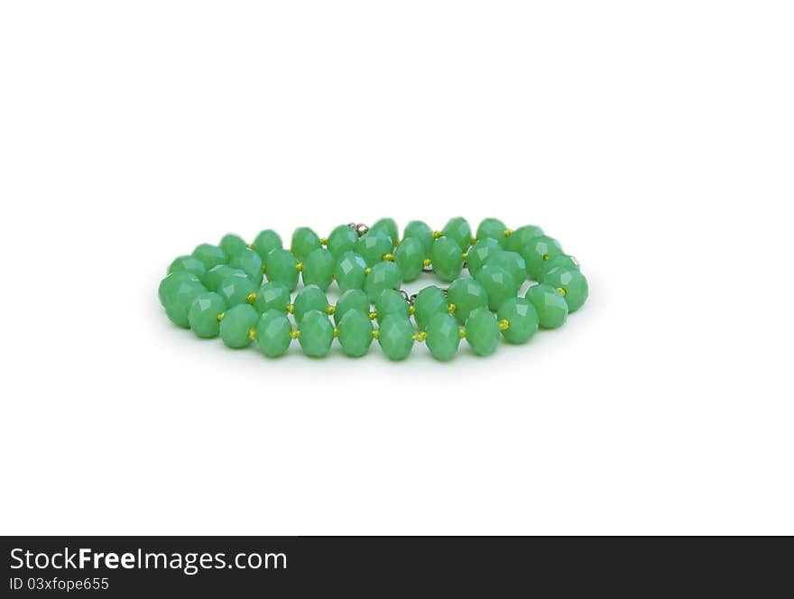 Necklace made of green beads isolated on white