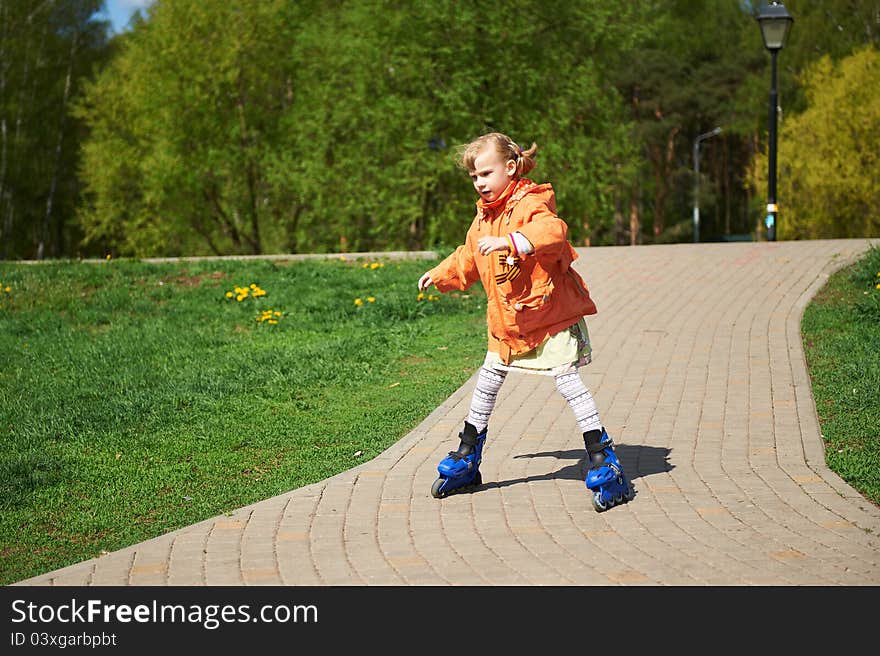 Girl rides on roller skates