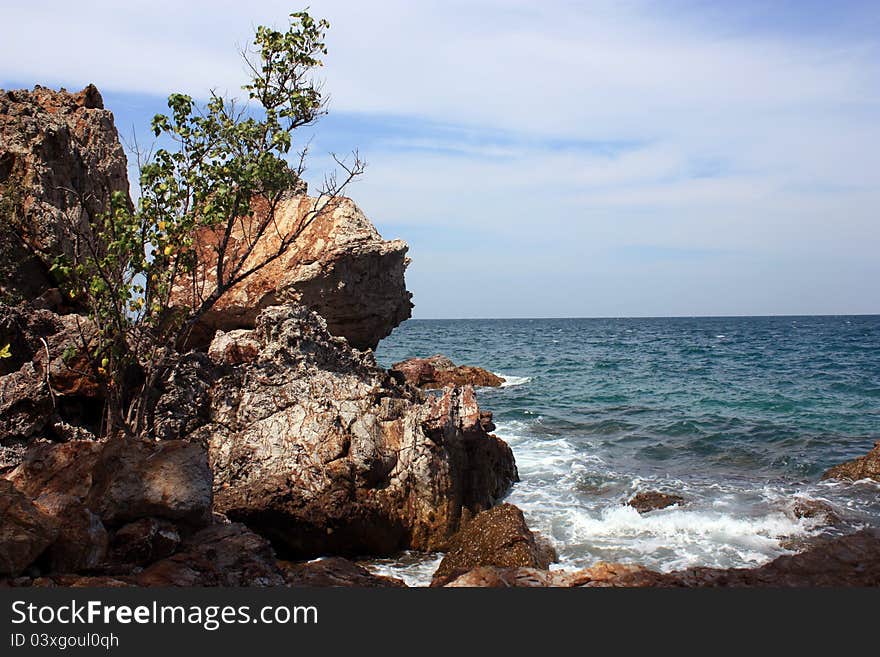 Blue sea near tall cliff. Blue sea near tall cliff