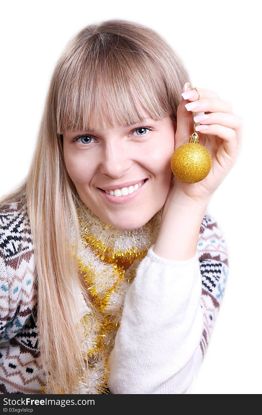 Beautiful woman holding a Christmas toy on white background. Beautiful woman holding a Christmas toy on white background