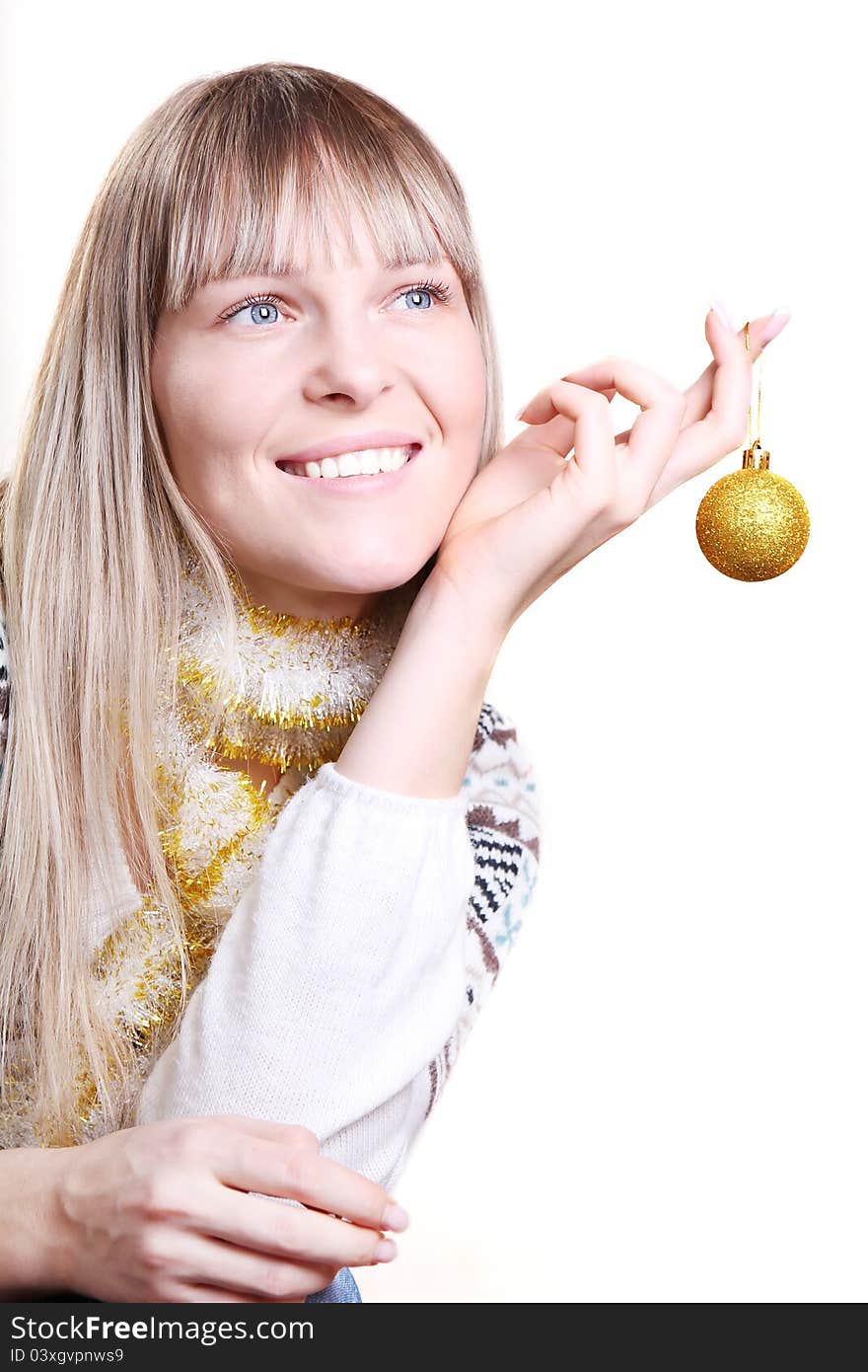 Beautiful woman holding a Christmas toy on white background. Beautiful woman holding a Christmas toy on white background