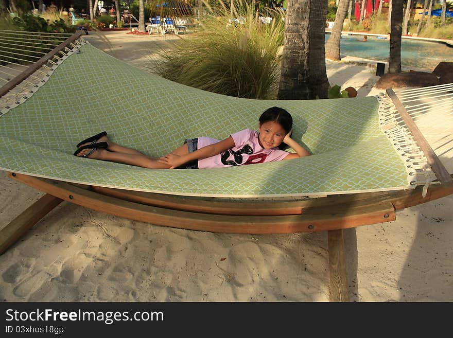 Little Chinese Girl On Hammock