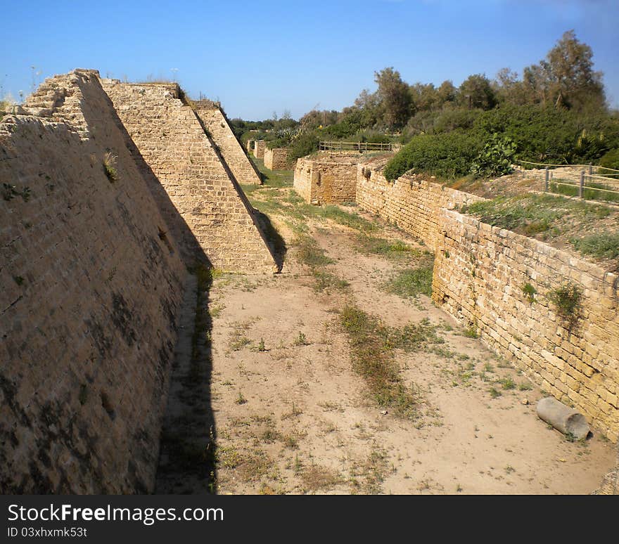 Moat dug by the Crusaders around the old city of Caesarea, Israel. Moat dug by the Crusaders around the old city of Caesarea, Israel.