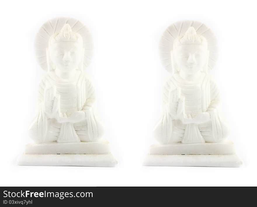 White Buddha stone carving on white background