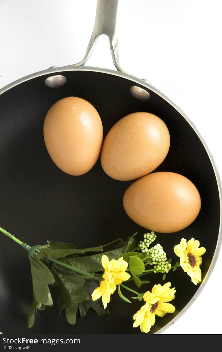 Eggs on pan in breakfast concept with blossom floral