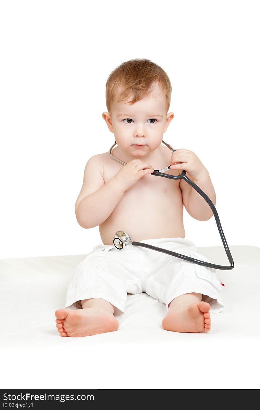 Adorable child with stethoscope in hands