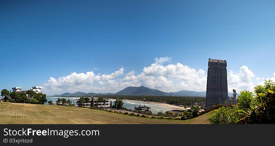 Beautiful panorama of South Indian temple architecture in Murudeshwara Beach -Gopuram or Gopura, is a monumental tower, usually ornate, at the entrance of any temple, especially in Southern India South Indian temple architecture. Murudeshwara -Karnataka. Beautiful panorama of South Indian temple architecture in Murudeshwara Beach -Gopuram or Gopura, is a monumental tower, usually ornate, at the entrance of any temple, especially in Southern India South Indian temple architecture. Murudeshwara -Karnataka