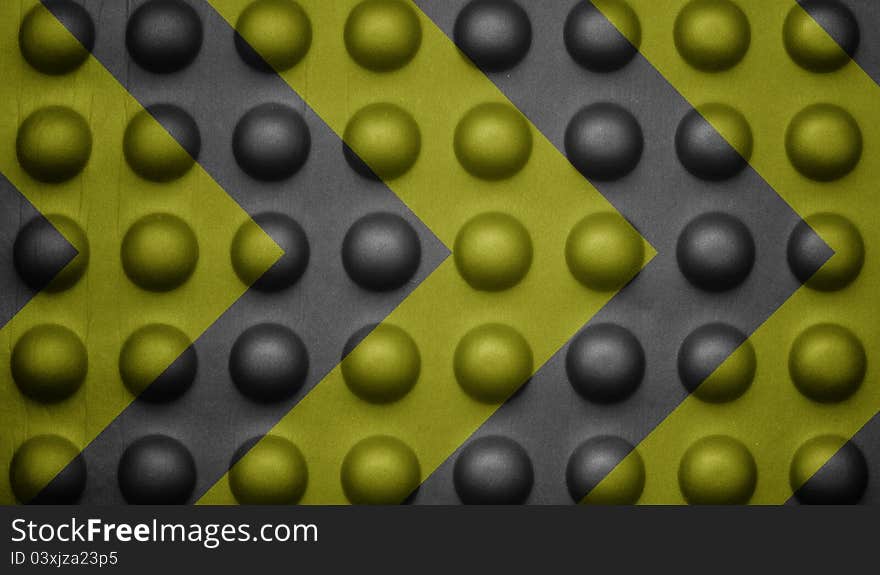 Yellow and black warning sign on bubble texture.