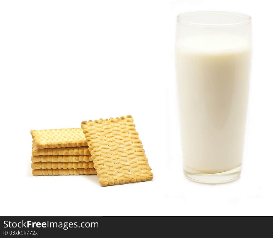 A glass of milk and six biscuits in white background. A glass of milk and six biscuits in white background