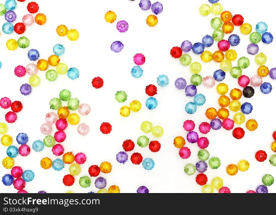 Colorful beads on white background