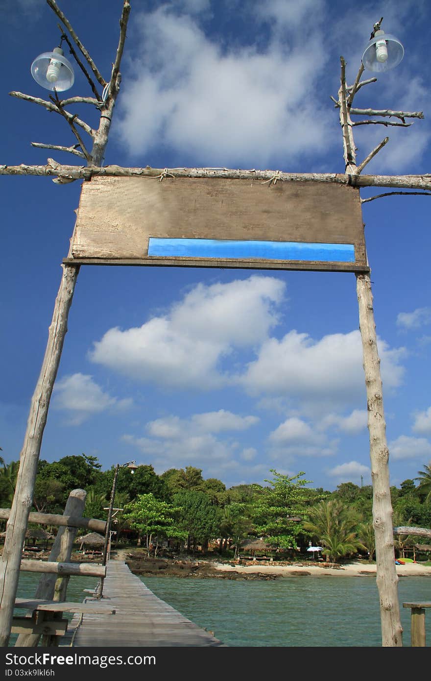 Blank wooden board on blue sky background