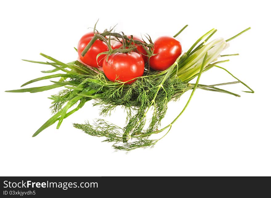 Branches Of Tomatoes Lay On Greens