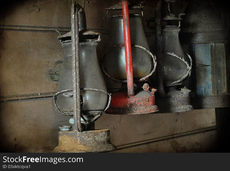 Vintage old lamps hanging in storage.