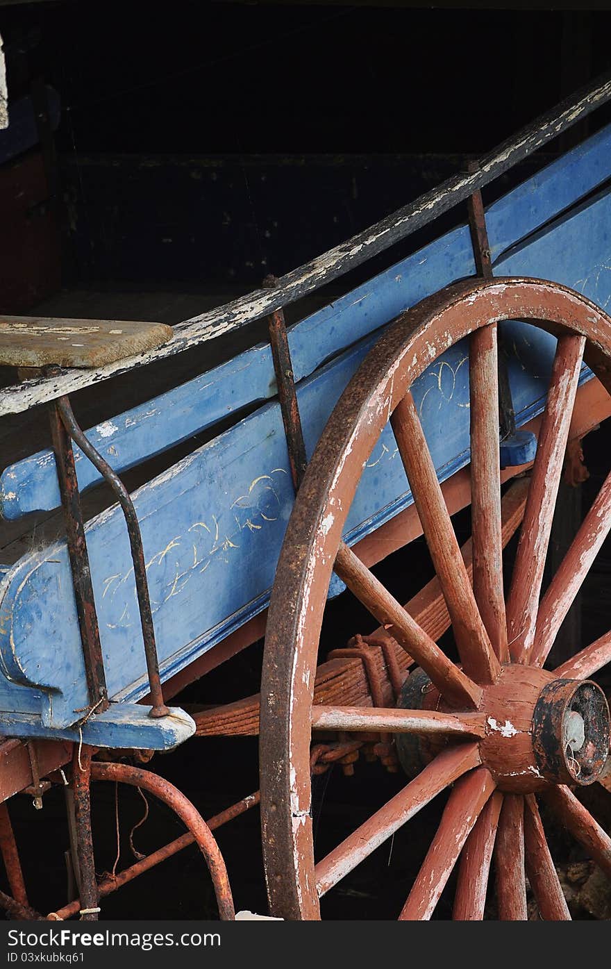 Old vintage horse drawn cart paked under awning. Old vintage horse drawn cart paked under awning.