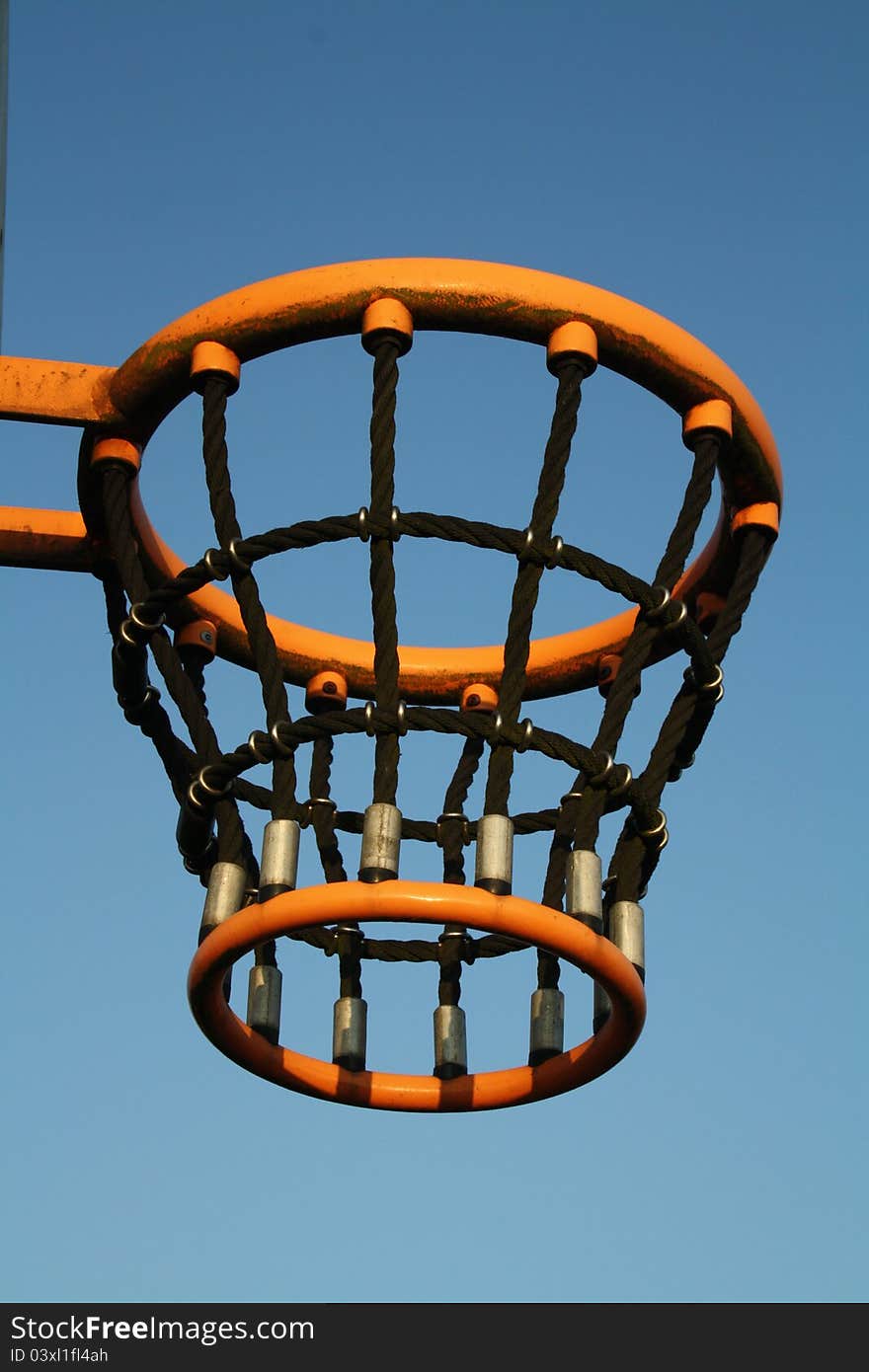 Basketball basket with a blue sky