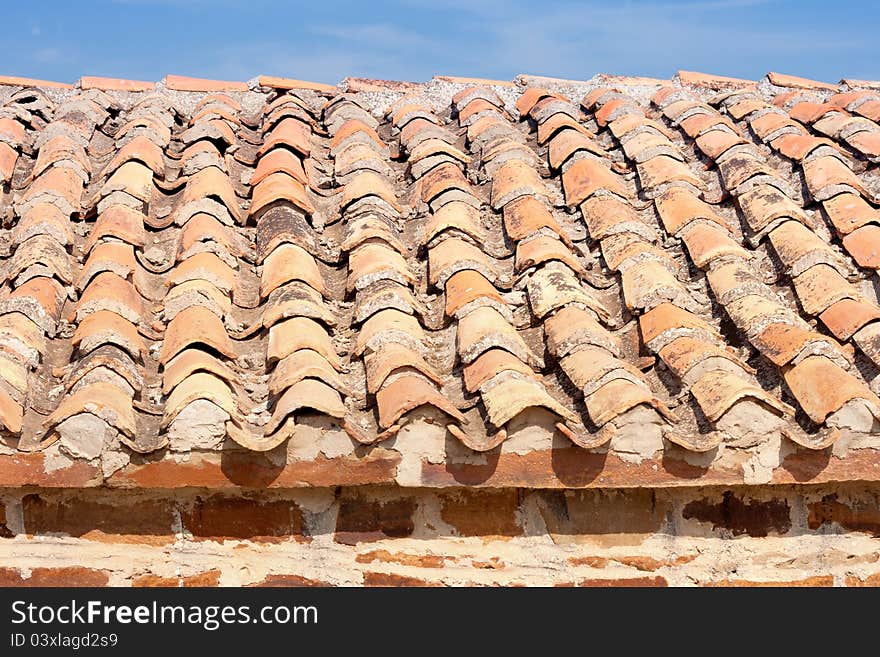 Old red and orange roof tiles. Old red and orange roof tiles