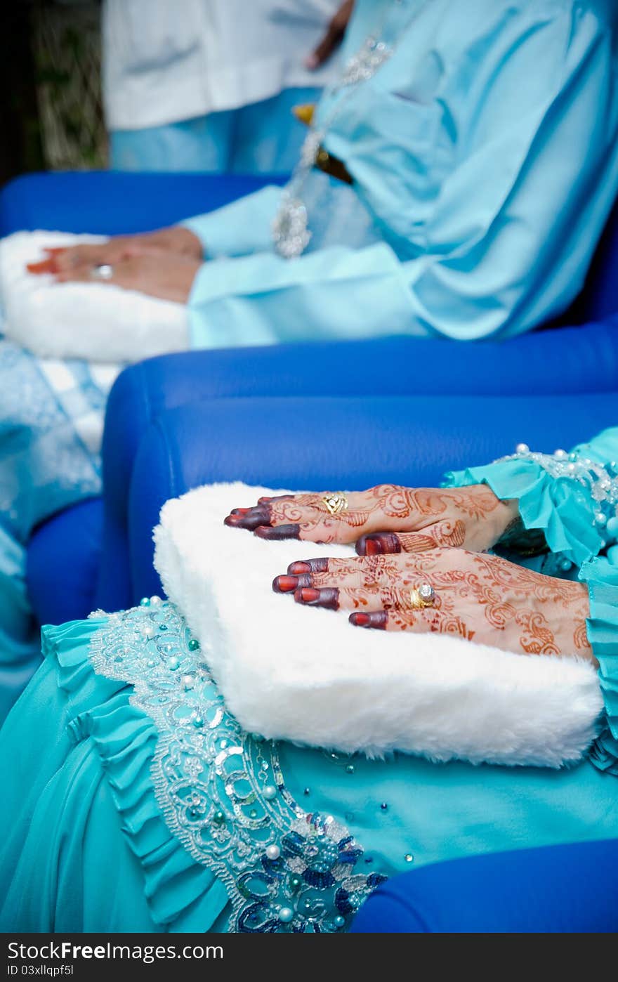 Bride's hands decorated with henna