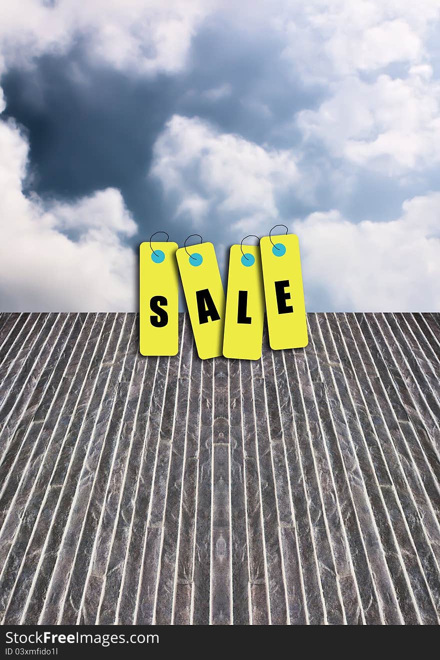 Tag sale on the surface of the stone with the sky as a backdrop.