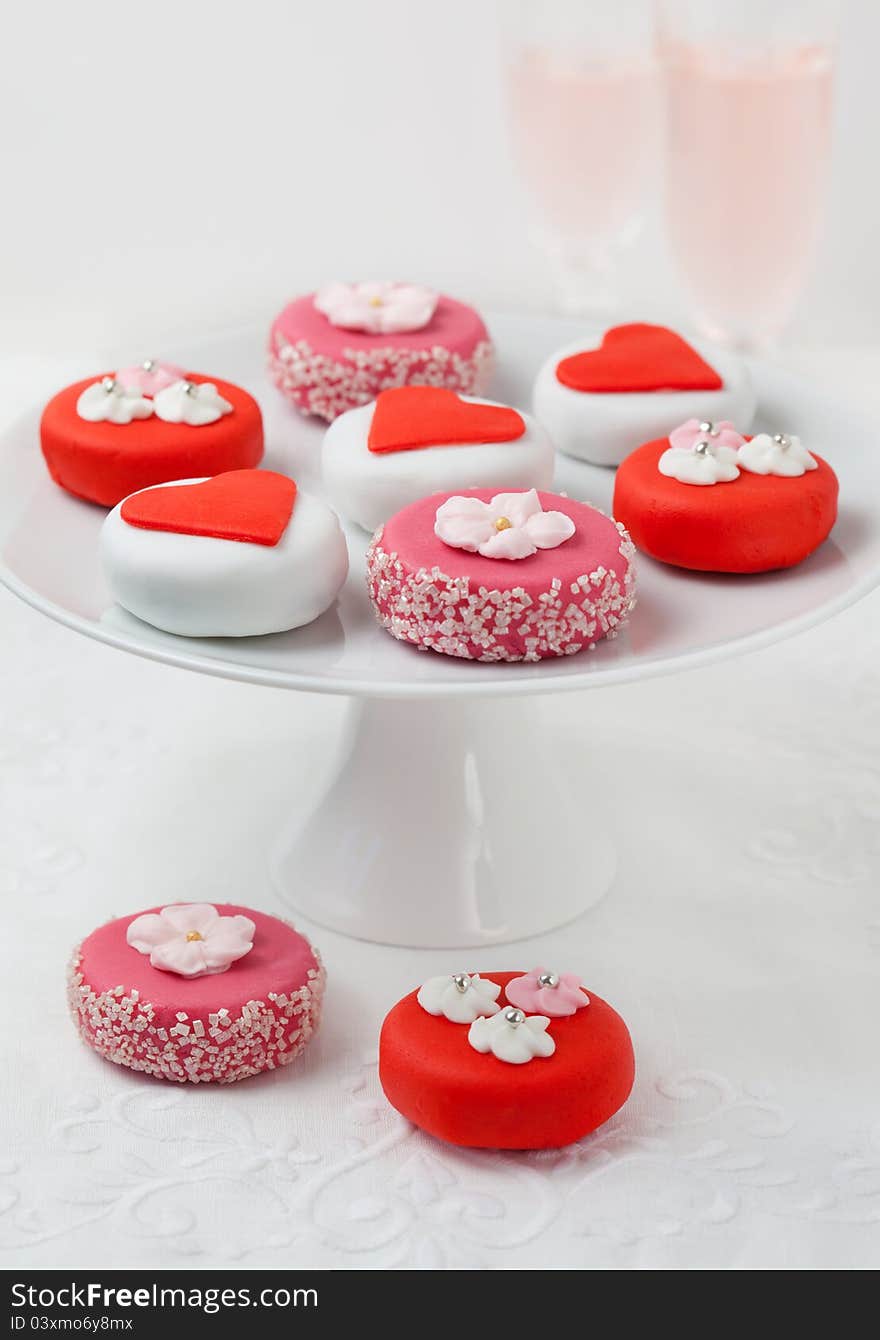 Sweet Valentine Petit Fours on a cake stand. Sweet Valentine Petit Fours on a cake stand