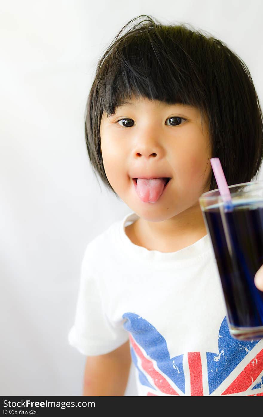 A girl show her tongue with butterfly pea juice