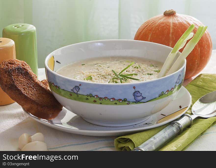 Soup of mashed potatoes from a pumpkin with crackers and grated cheese. Soup of mashed potatoes from a pumpkin with crackers and grated cheese